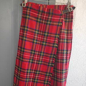 This is a vintage The Scotch House red tartan plaid wool kilt skirt.
